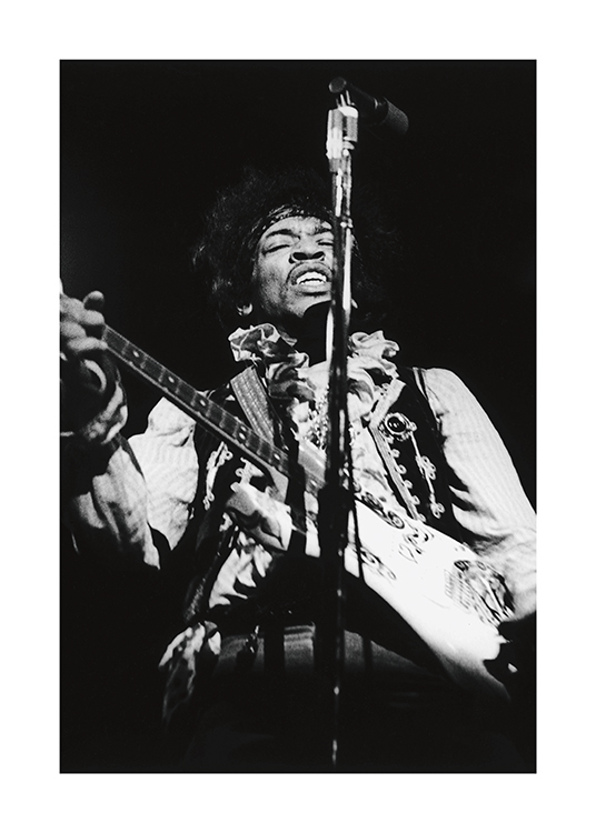  – Schwarz-Weiß-Fotografie des Musikers Jimi Hendrix beim Gitarrenspielen